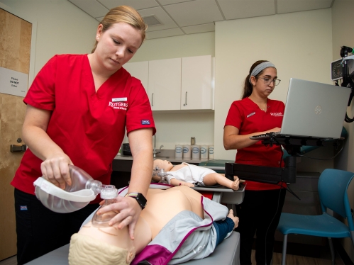 Student nurse applying CPR